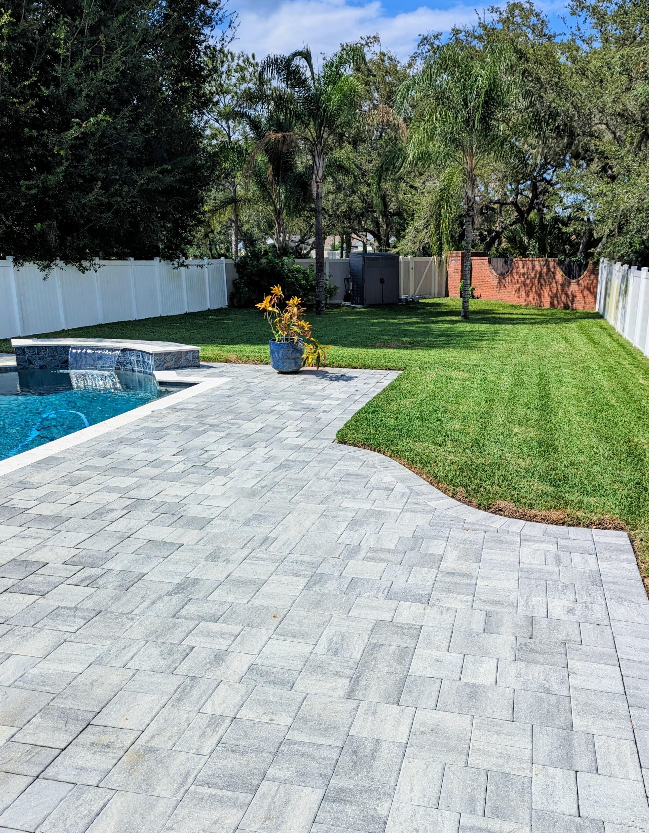 Beautifully maintained backyard lawn in Winter Springs, Florida with expert mowing and trimming by Freedom Lawn Pros